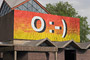 'Angel',  by Rose Finn-Kelcey, on the facade of St Paul's Parish Church, Burdett Road, June 2004