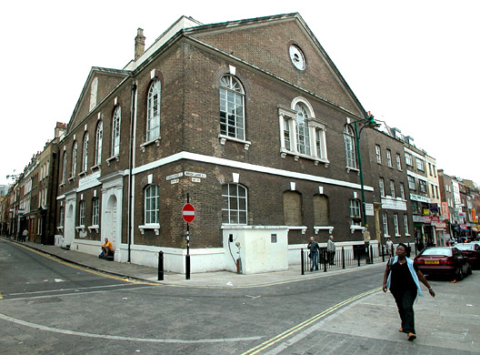 Former Hugenot chapel,synagogue and now Mosque, corner of Brick Lane and Fournier Street, July 2003