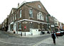 Former Hugenot chapel,synagogue and now Mosque, corner of Brick Lane and Fournier Street, July 2003